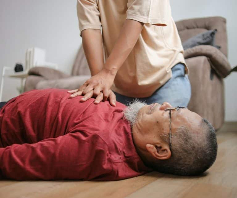 Close up of a person giving CPR